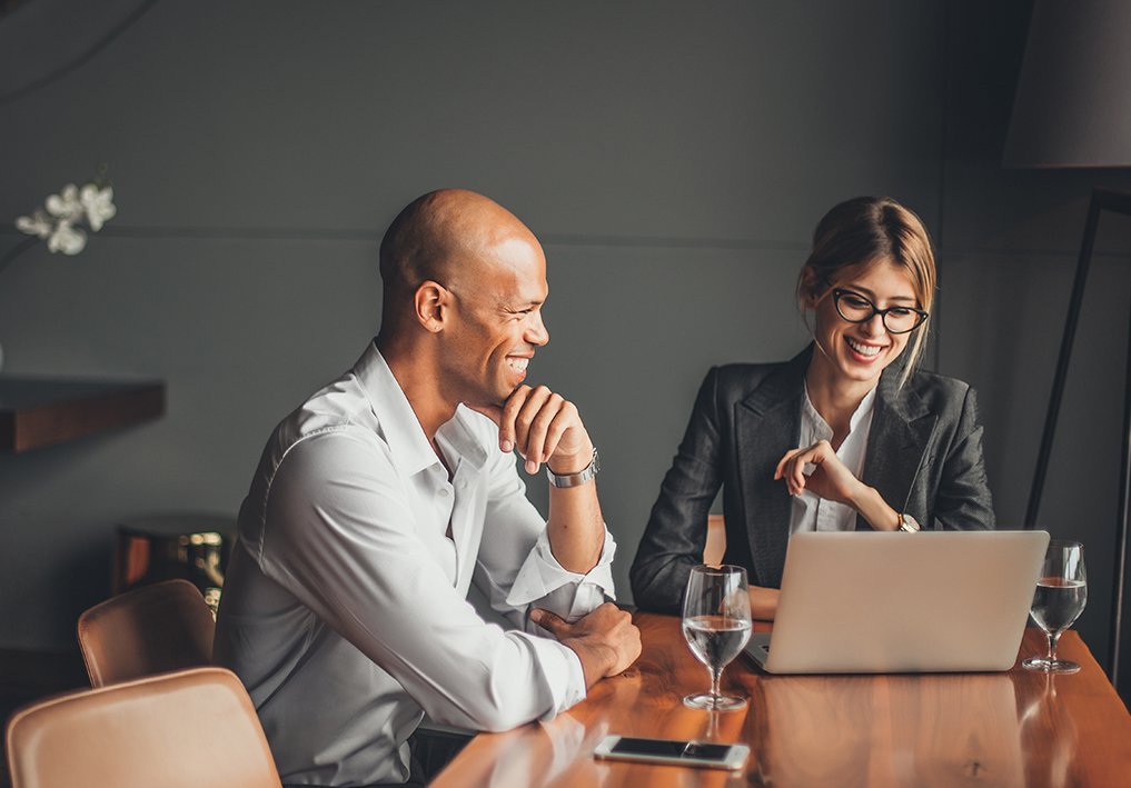 Man and Woman discussing business information